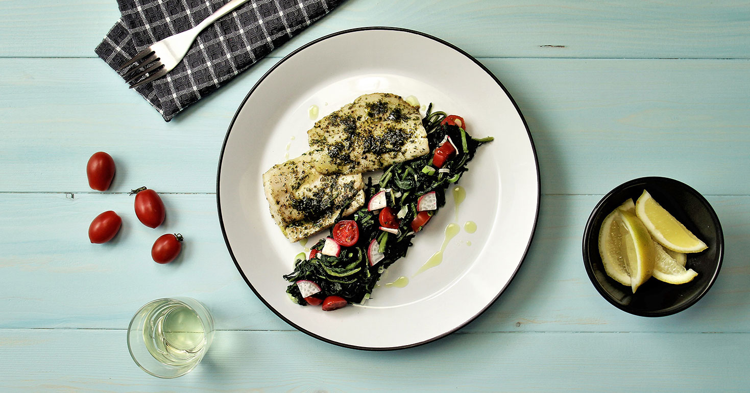 Hake With Aromatic Basil Butter On Seasonal Greens