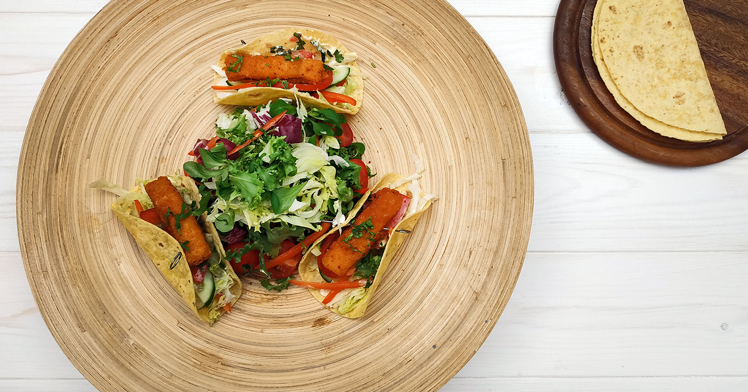 Tacos Filled With Fish Sticks, Vegetables And Lime (Mayo, Iceberg Lettuce, Tomato, Coriander, Cucumber, Red Pepper)